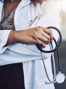 physician with stethoscope